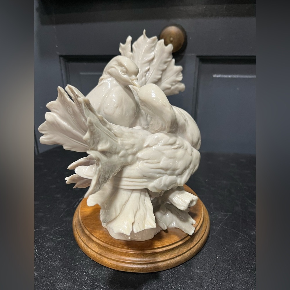 Lead	Giuseppe Armani love birds kissing doves